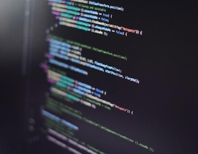 Colorful programming code on black screen. 