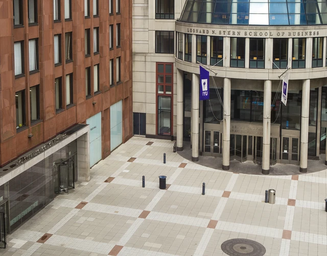 aerial view of NYU Stern's Gould Plaza, with brick Tisch building and cement rotunda in view