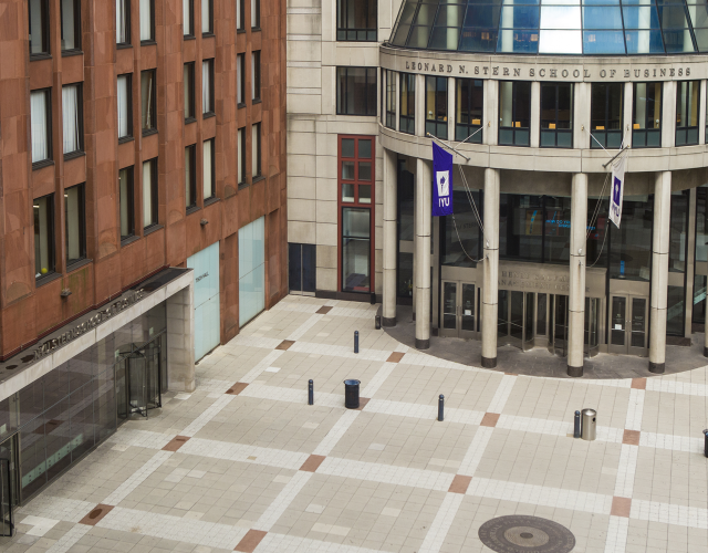 aerial view of NYU Stern's Gould Plaza, with brick Tisch building and cement rotunda in view