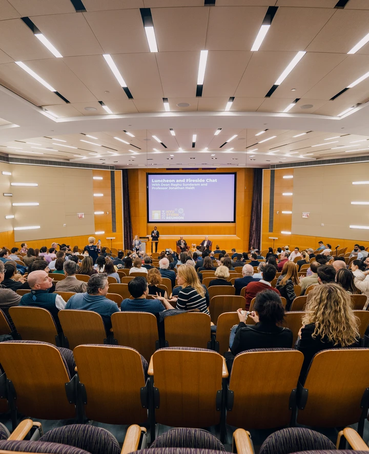 Stern alumni gather at a lecture as part of Reunion 2024