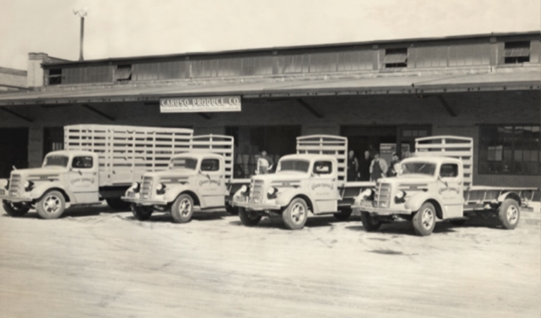 Black and white photo of the grocery vehicles outside the Central New York Regional Market Authority