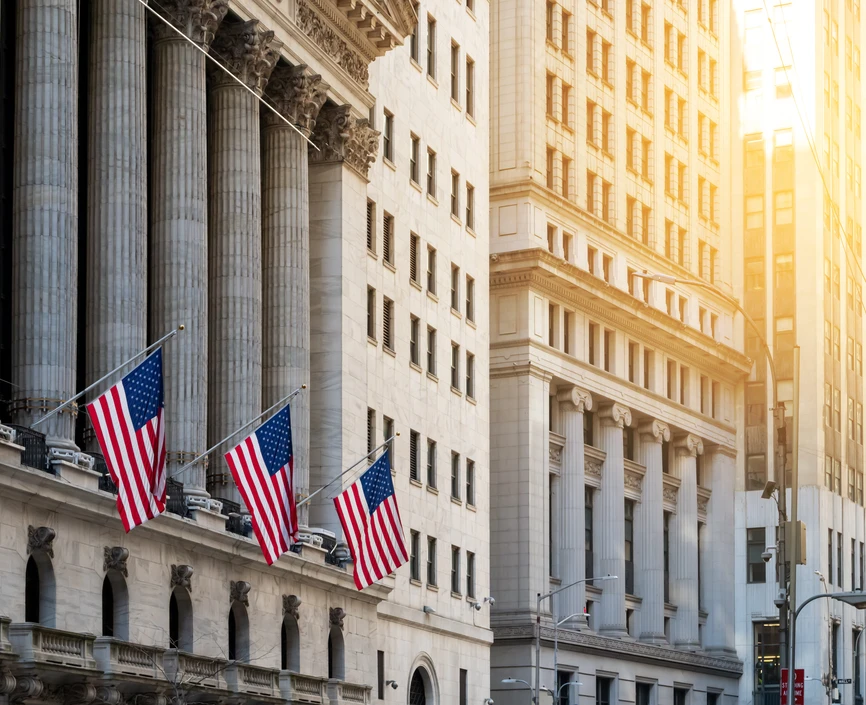 American flags flying in front of the New York Stock Exchange