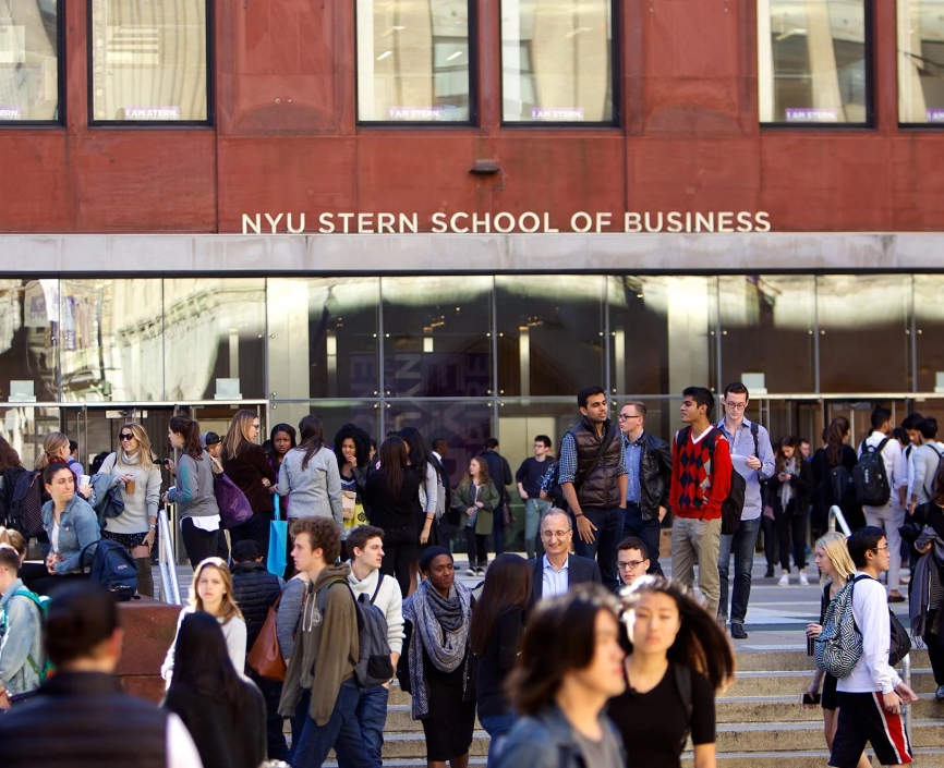 Students huddle in front of Stern Business School 