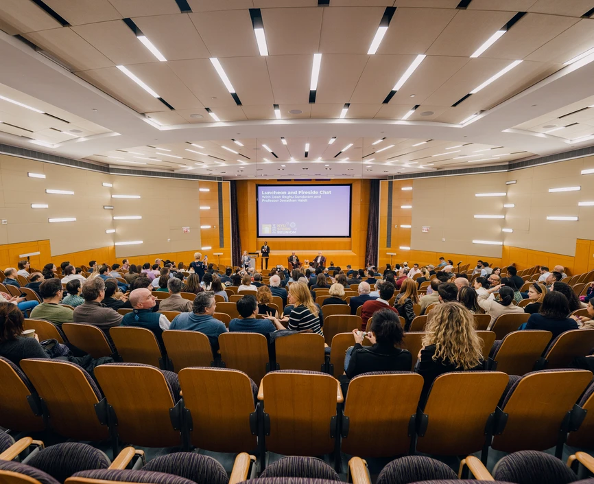 Stern alumni gather at a lecture as part of Reunion 2024