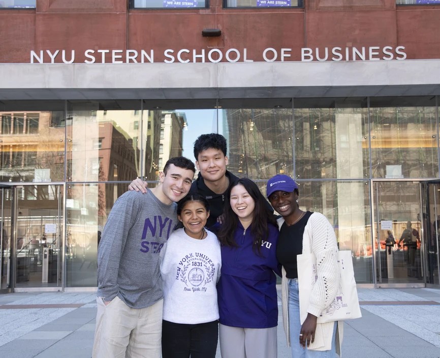 Undergraduate students pose in front of Tisch Hall