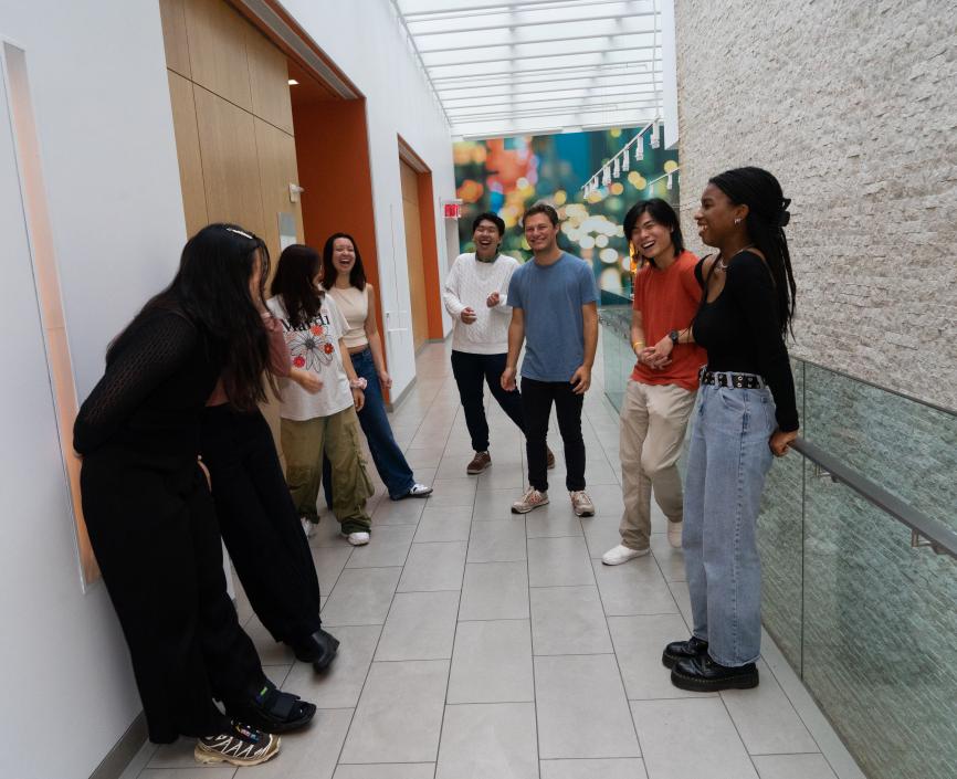 Students in UC hallway laughing