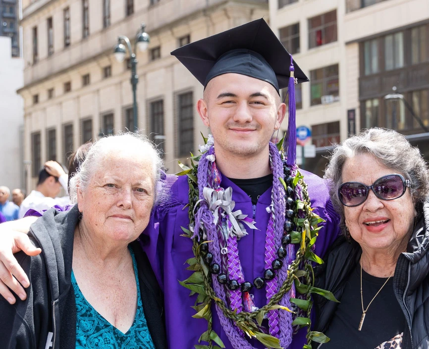 Graduation Stern senior posing with family members