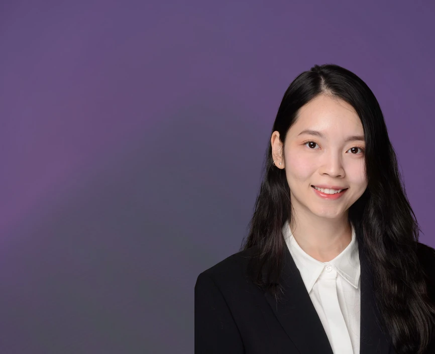 Trang Hoang headshot on a purple background