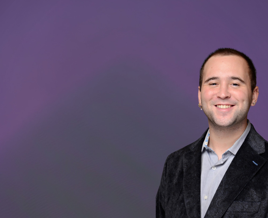 Connor Silverstein headshot on a purple background