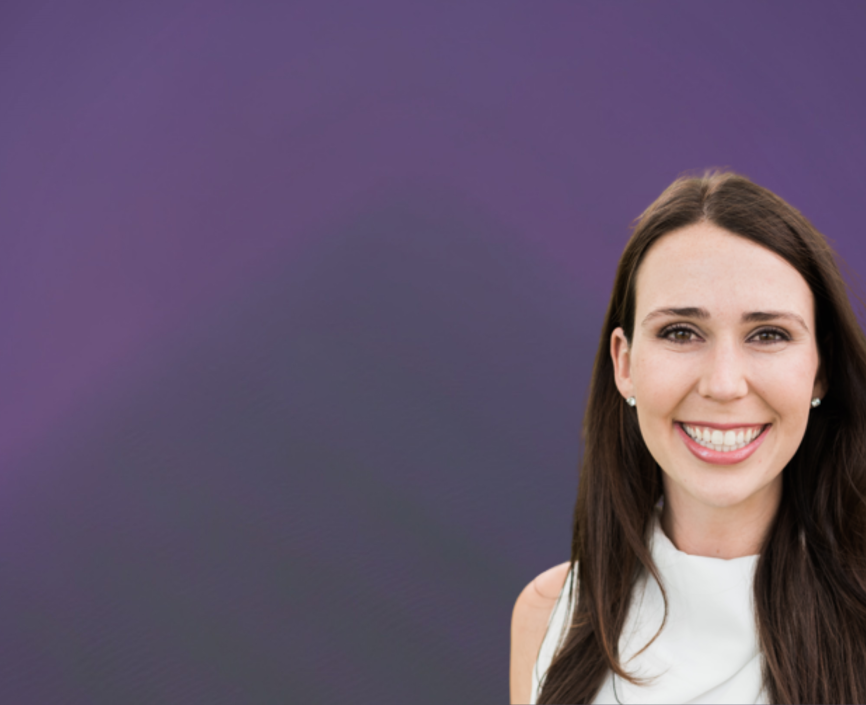 Kate Thomson headshot on a purple background