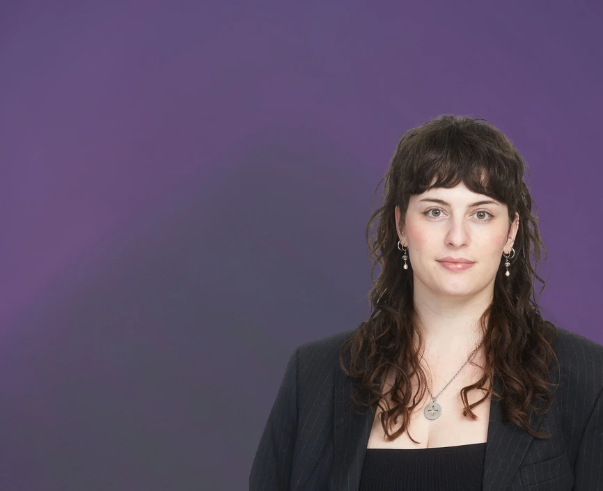 Odalia Zubarev headshot in front of the purple background