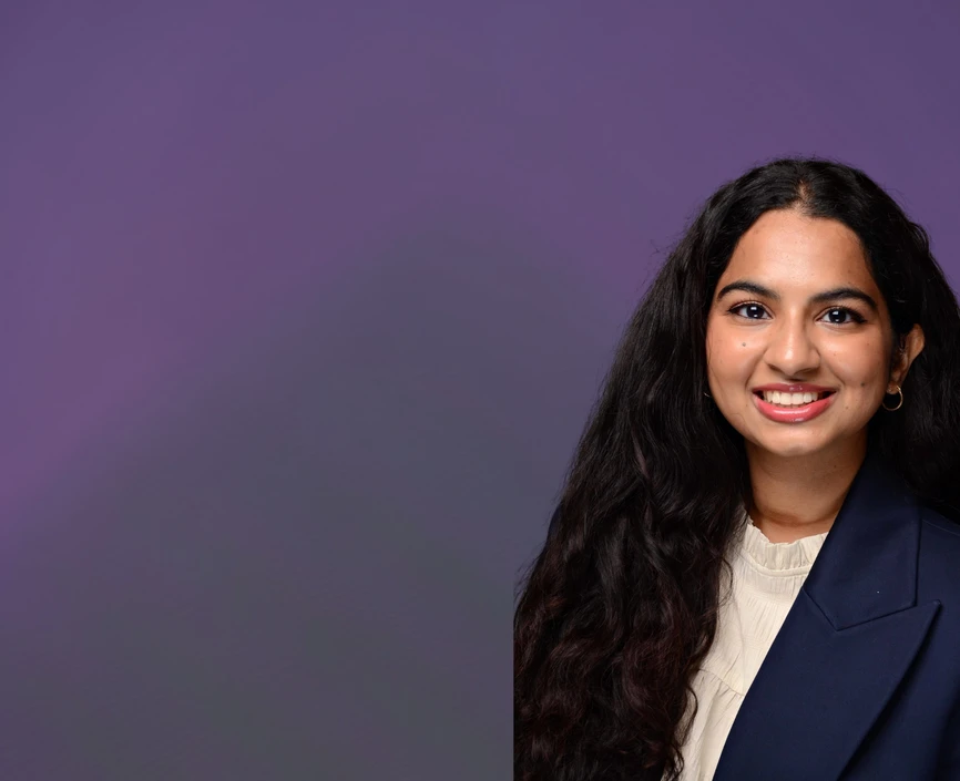 Smriti Ashok headshot on a purple background