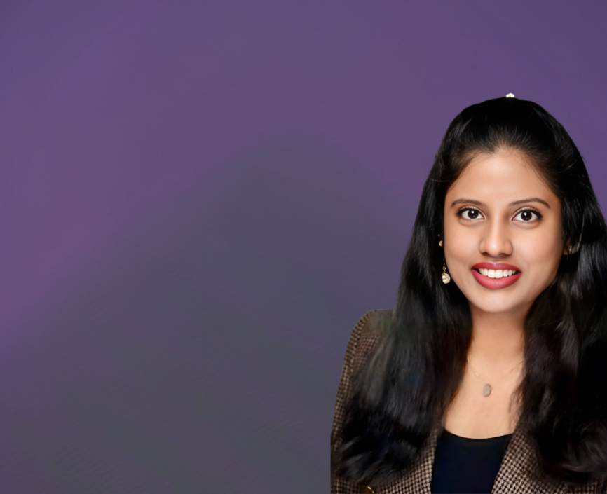 Sri Pooja Ravipati headshot on a purple background