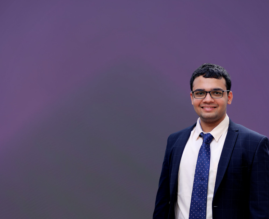 Tanmay Chhaparia headshot on a purple background
