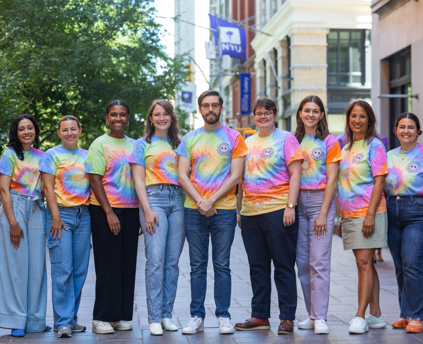UC Advising Team stands in a line outside of Shimkin Hall
