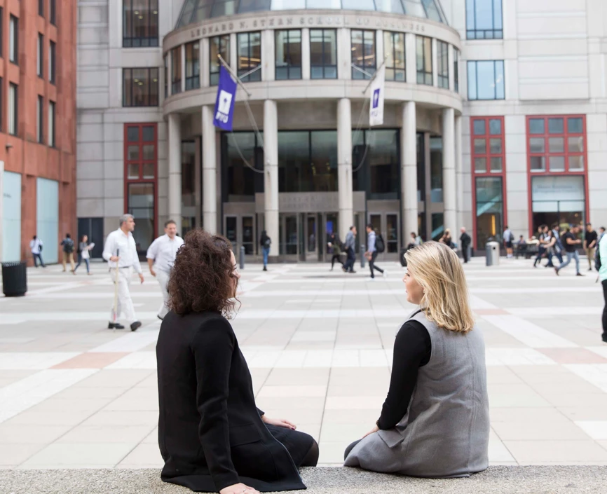 Two Women Sitting on Gould Plaza