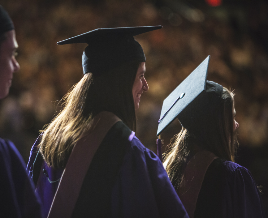Grads walk across the stage at MSG