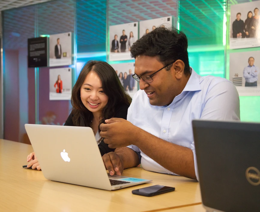 Stern students looking at a computer