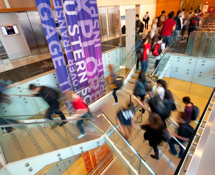 Students on the stairs of Tisch