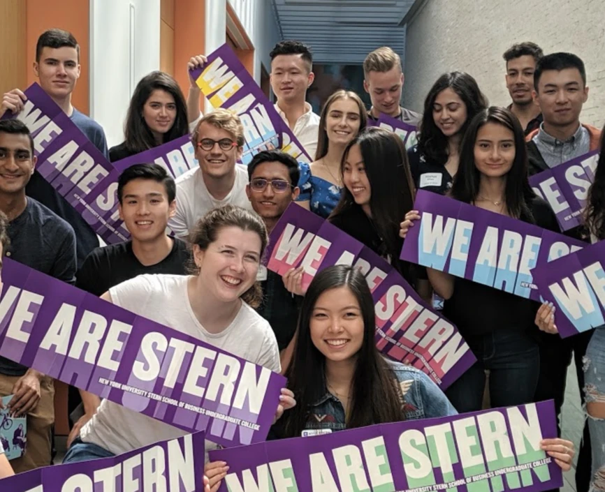 Transfer students at 2019 Orientation hold up a banner