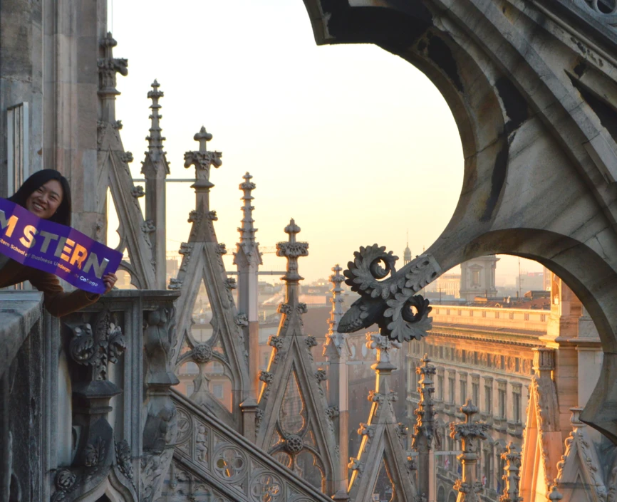 A student on IBEX holds a banner