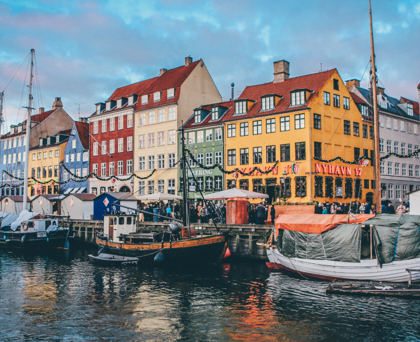 Buildings and boats line a channel in Copenhagen