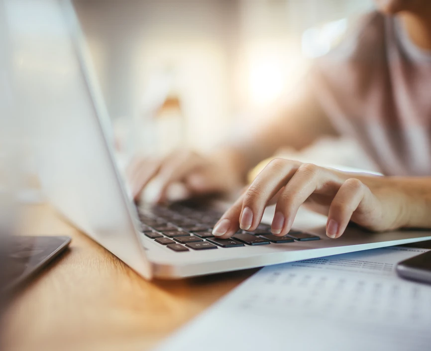 Girl typing on a laptop 