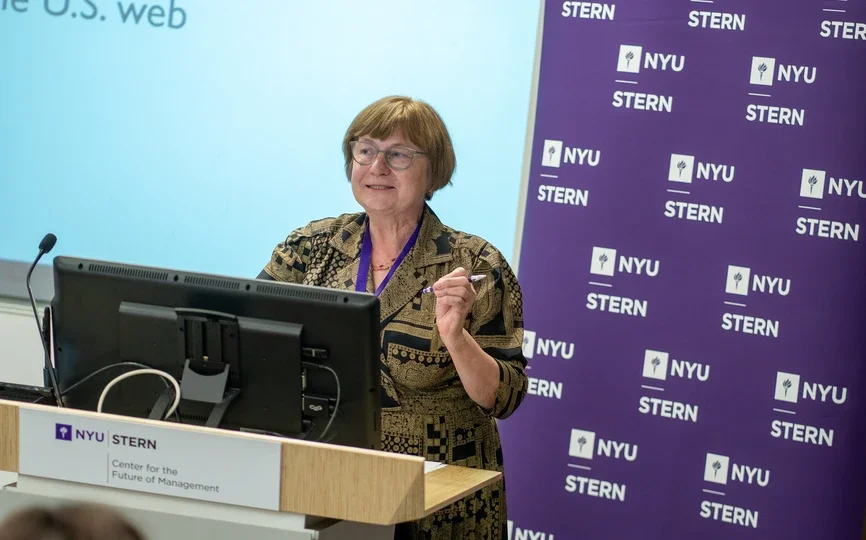 carol robbins speaking at a podium