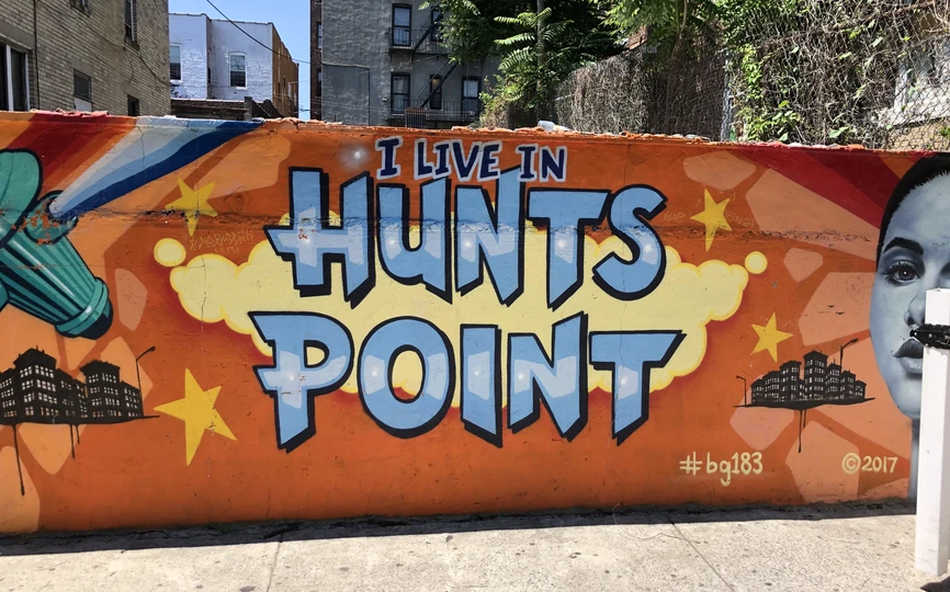 Image of a mural on the wall of a building that says I live in Hunts Point