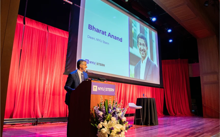 Dean Bharat Anand at the podium