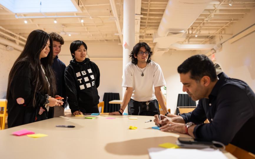 Students with Khubani Business Technology and Entrepreneurship (BTE) Founding Academic Director Ashish Bhatia at the annual Khubani BTE Design Sprint, applying design thinking to address real-world business challenges faced by New York City startups
