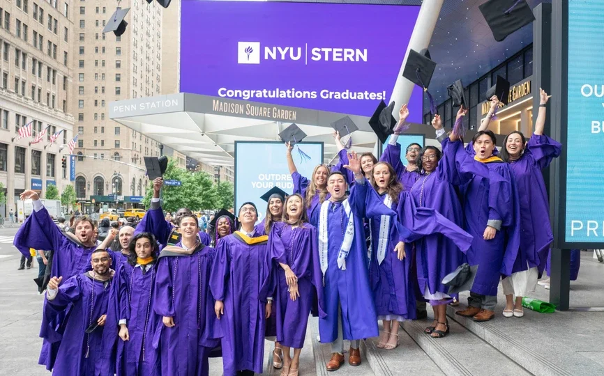NYU Stern students celebrating graduation outside of MSG.