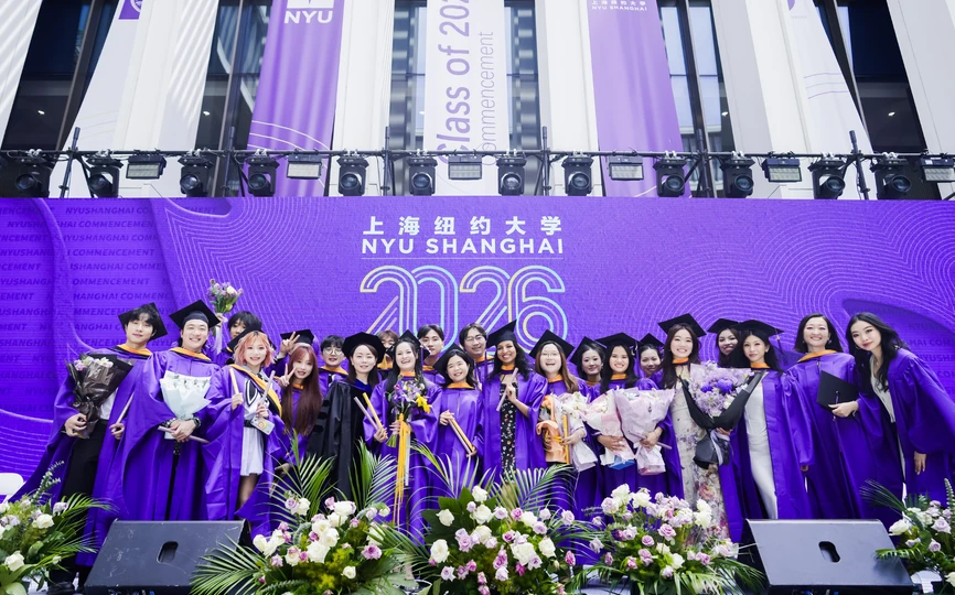 A group of students post for a photo as NYU Shanghai’s Business Ceremony recognized Class of 2026 graduates from the four joint NYU Shanghai and NYU Stern MS programs.
