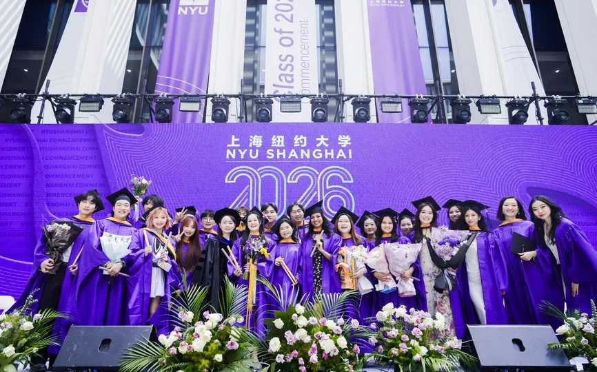 A group of students post for a photo as NYU Shanghai’s Business Ceremony recognized Class of 2026 graduates from the four joint NYU Shanghai and NYU Stern MS programs.