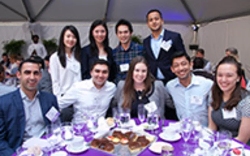 A group of Stern Alumni pose at a Reunion 2018 event