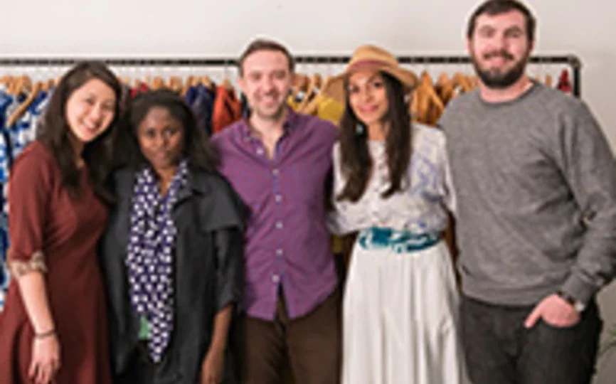 A group of NYU Stern MBA students stand with Stern alumna Abrima Erwiah (BS ‘02) and actress Rosario Dawson, co-founders of Studio One Eighty Nine