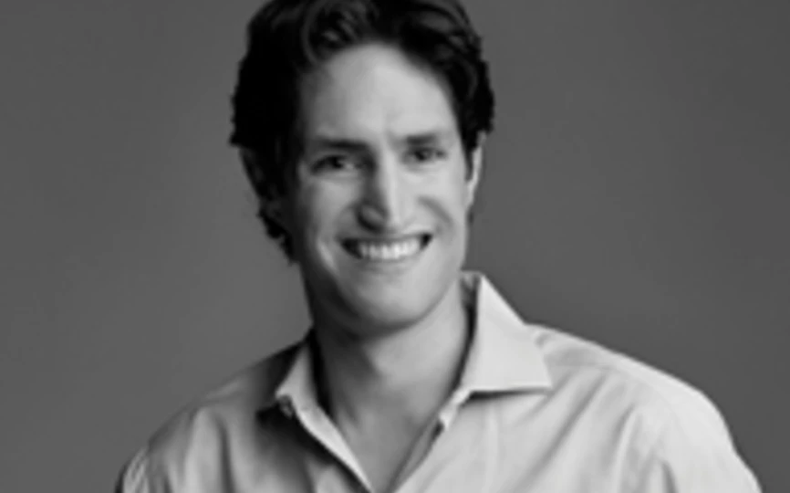 black and white headshot of professor adam alter
