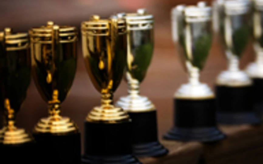 multiple small goblet trophies in a line