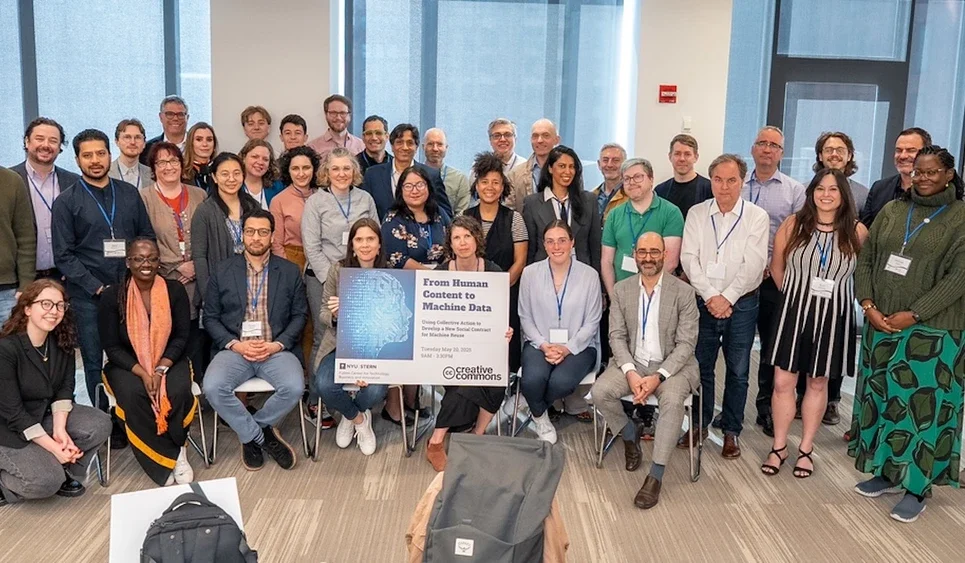 group photos of guests at the Creative Commons event holding the event poster