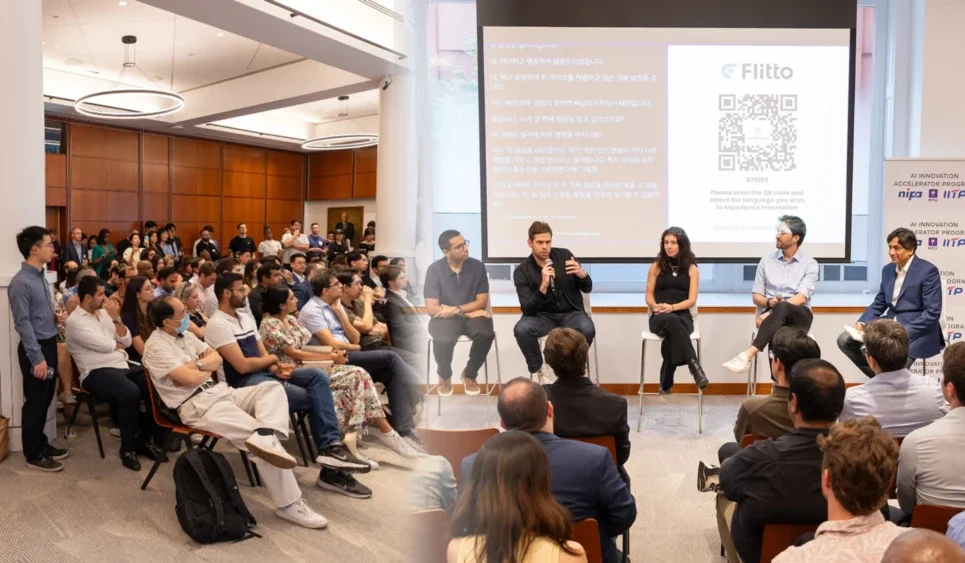 a large audience watches panel speakers