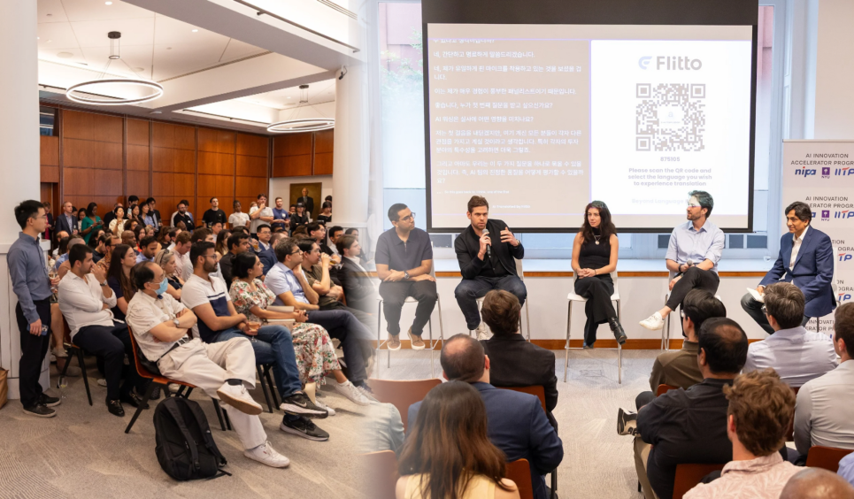 a large audience watches panel speakers