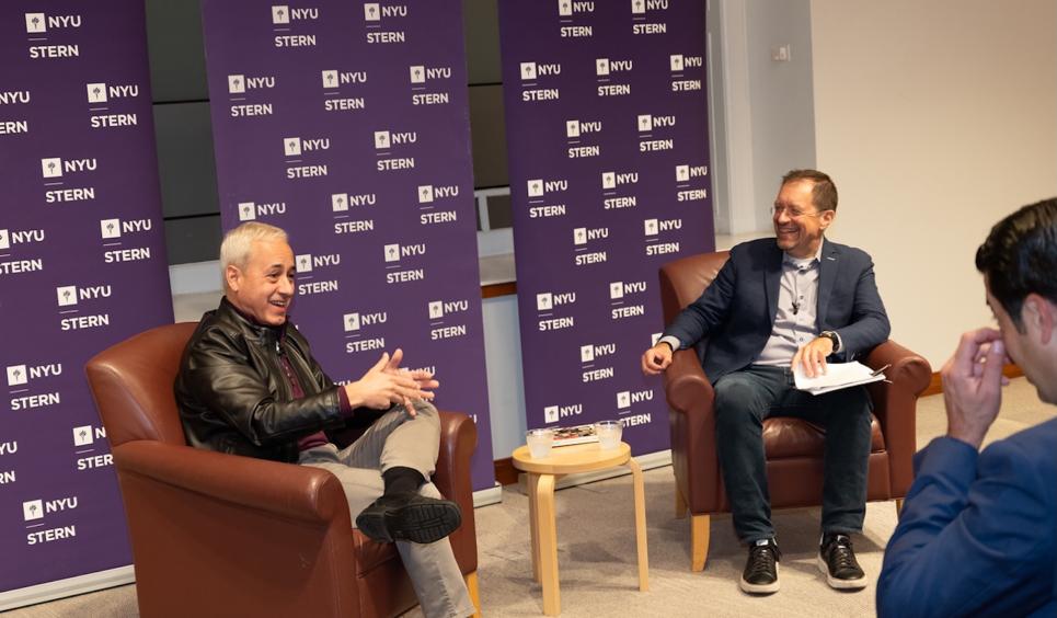 Domingos speaks with Professor Foster Provost
