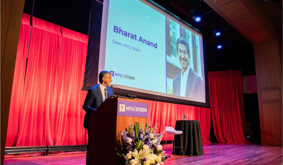 Dean Bharat Anand at the podium