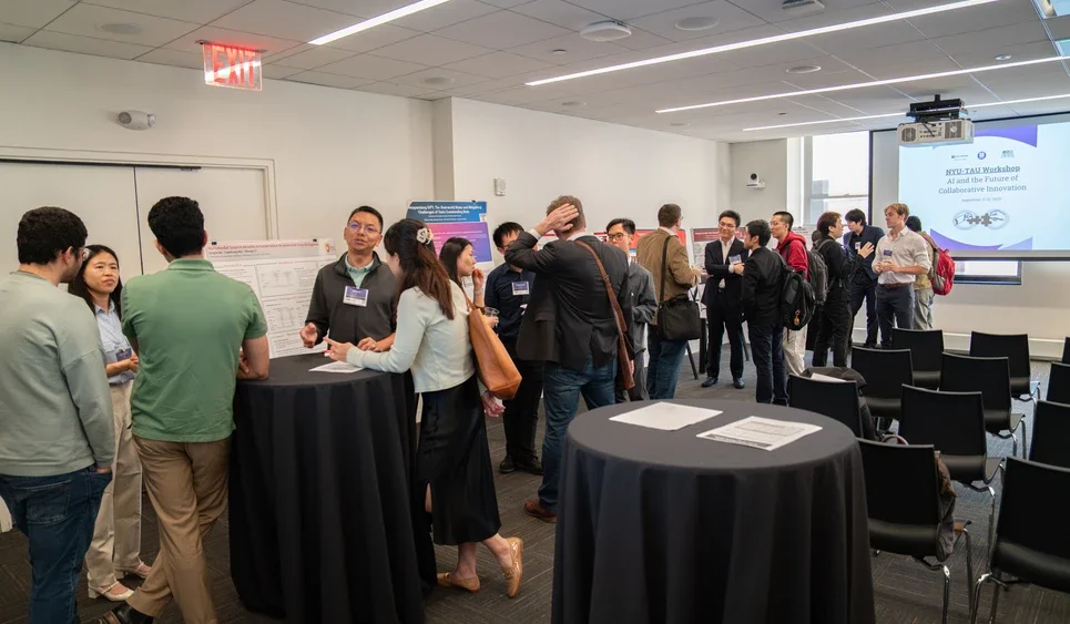 workshop attendees stand and socialize
