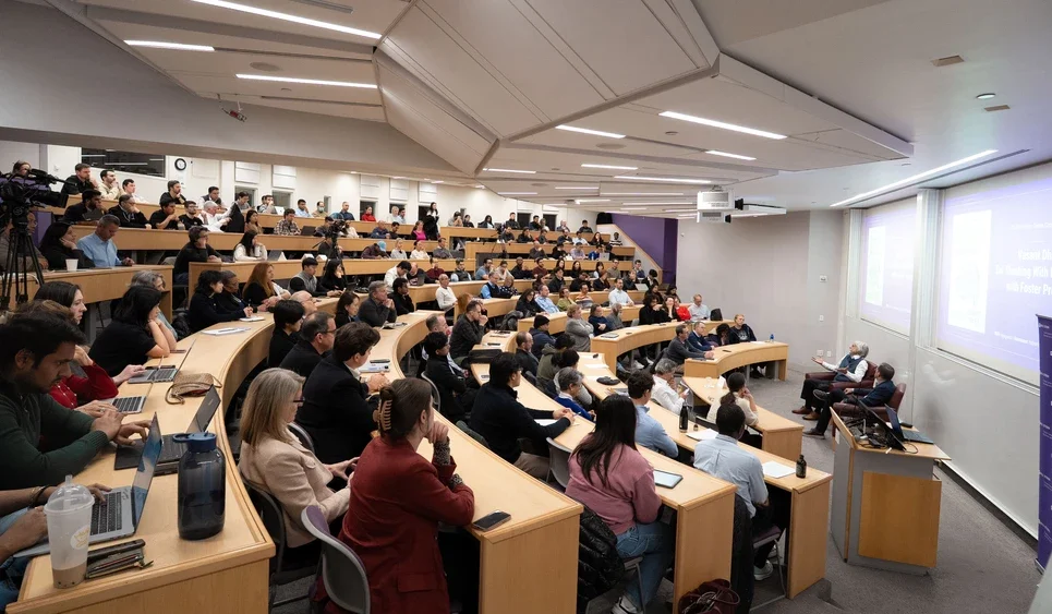 audience watches Dhar and Provost speak