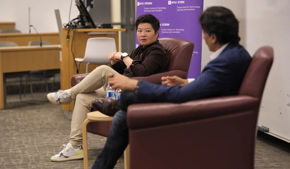 Jen Wong and Arun Sundararajan sitting and talking