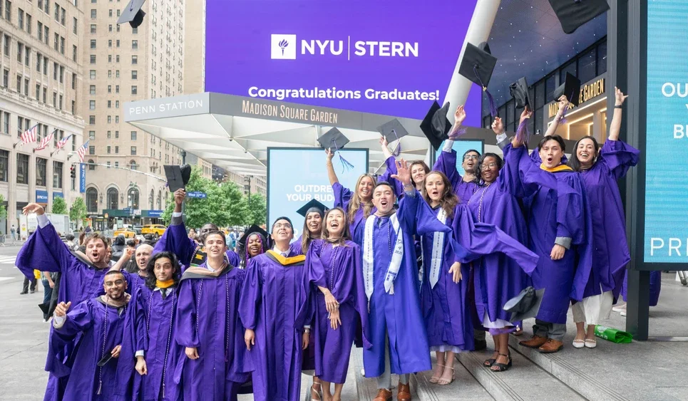 NYU Stern students celebrating graduation outside of MSG.