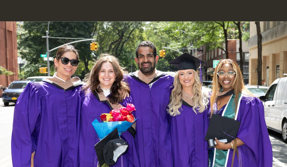 Students celebrating NYU Stern’s Executive MBA Graduation Celebration for the Class of 2026 on July 31. 