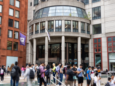 stern's kmc building with students walking in front