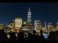 Undergraduate students taking photos of NYC skyline